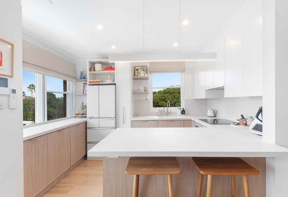 Immaculately Renovated East-Facing Apartment with Coastal Charm and Convenient Location